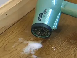 using hair dryer removing wax