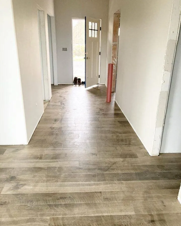 white painted wide plank farmhouse bedroom floor with board and batten walls
