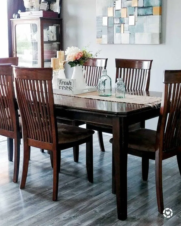 reclaimed wide plank farmhouse living room stone fireplace wood staircase