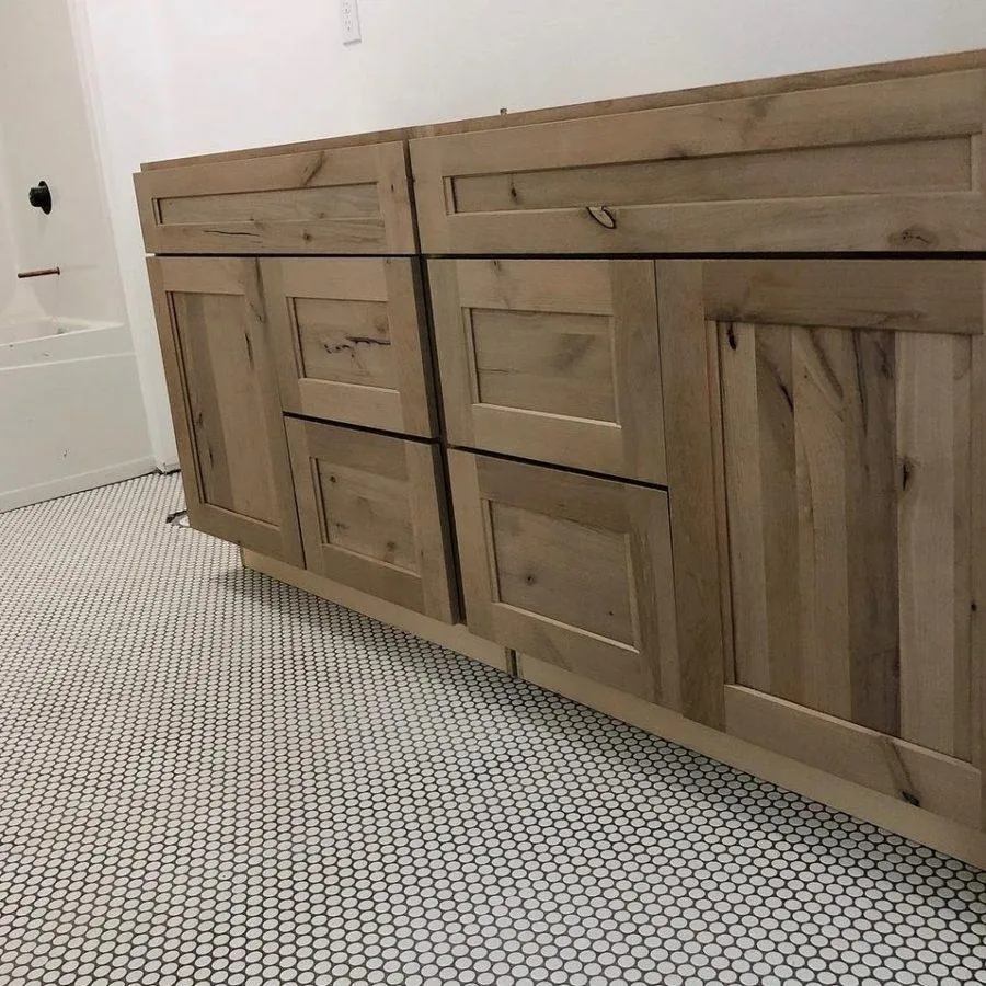 terracotta tile floor farmhouse room with exposed brick fireplace wood burning stove and beams