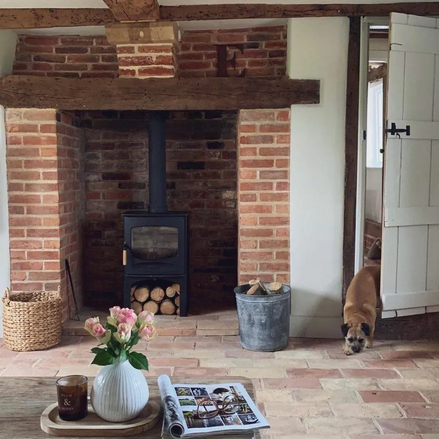 gray washed laminate wood flooring farmhouse dining room with dark wood furniture and decor