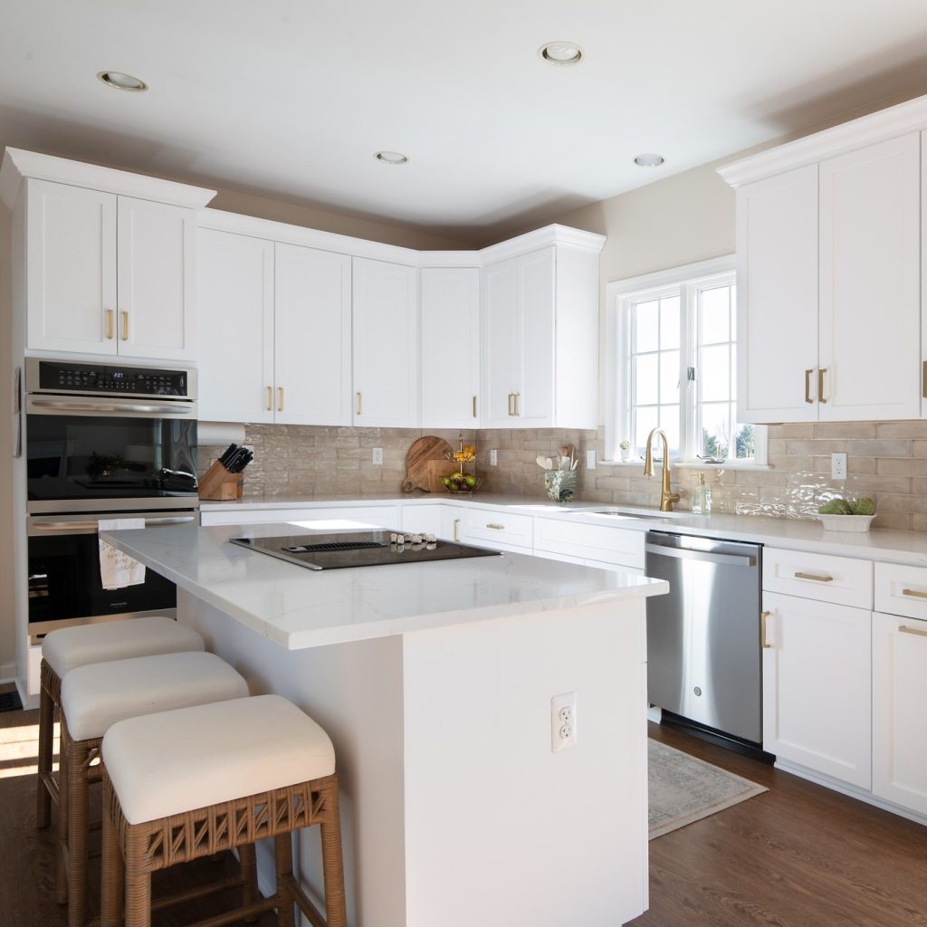 white kitchen cabinets with gold hardware