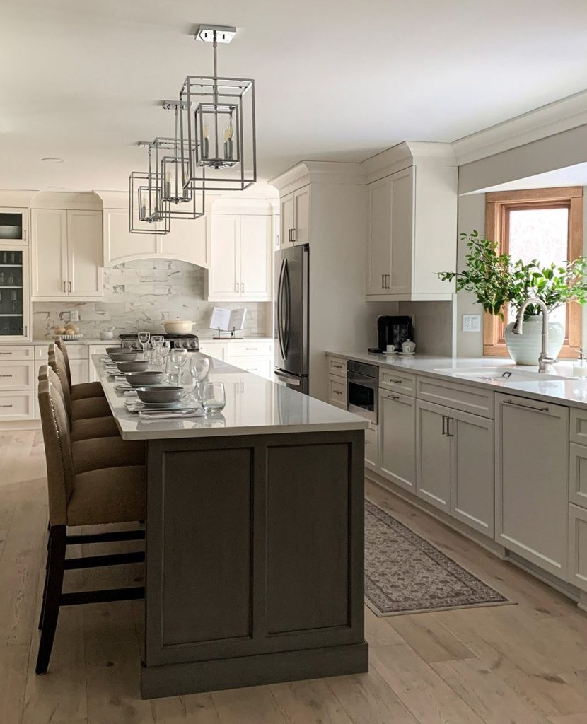  crisp white cabinetry is paired with a striking dark island