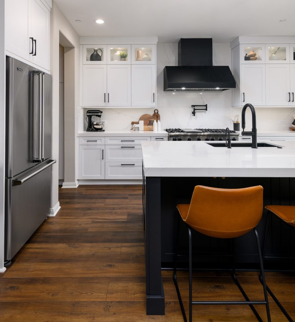  white cabinets and a sleek black island