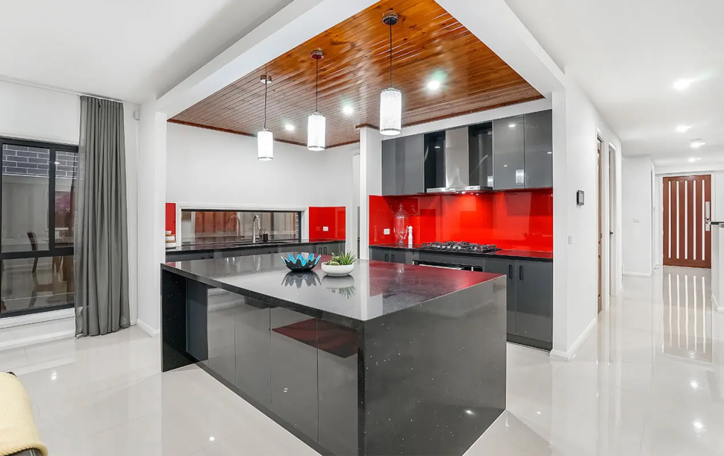 black cabinets red wall kitchen